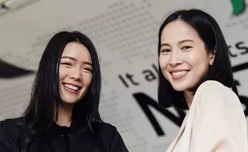 Two young women smiling