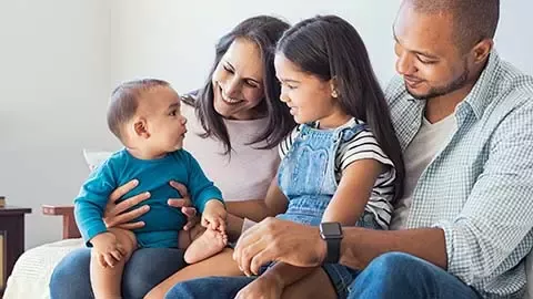 Afro-American family holding a child 