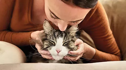 a woman with a cat