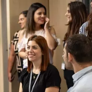 Employees collaborating during a workplace meeting in a modern office environment